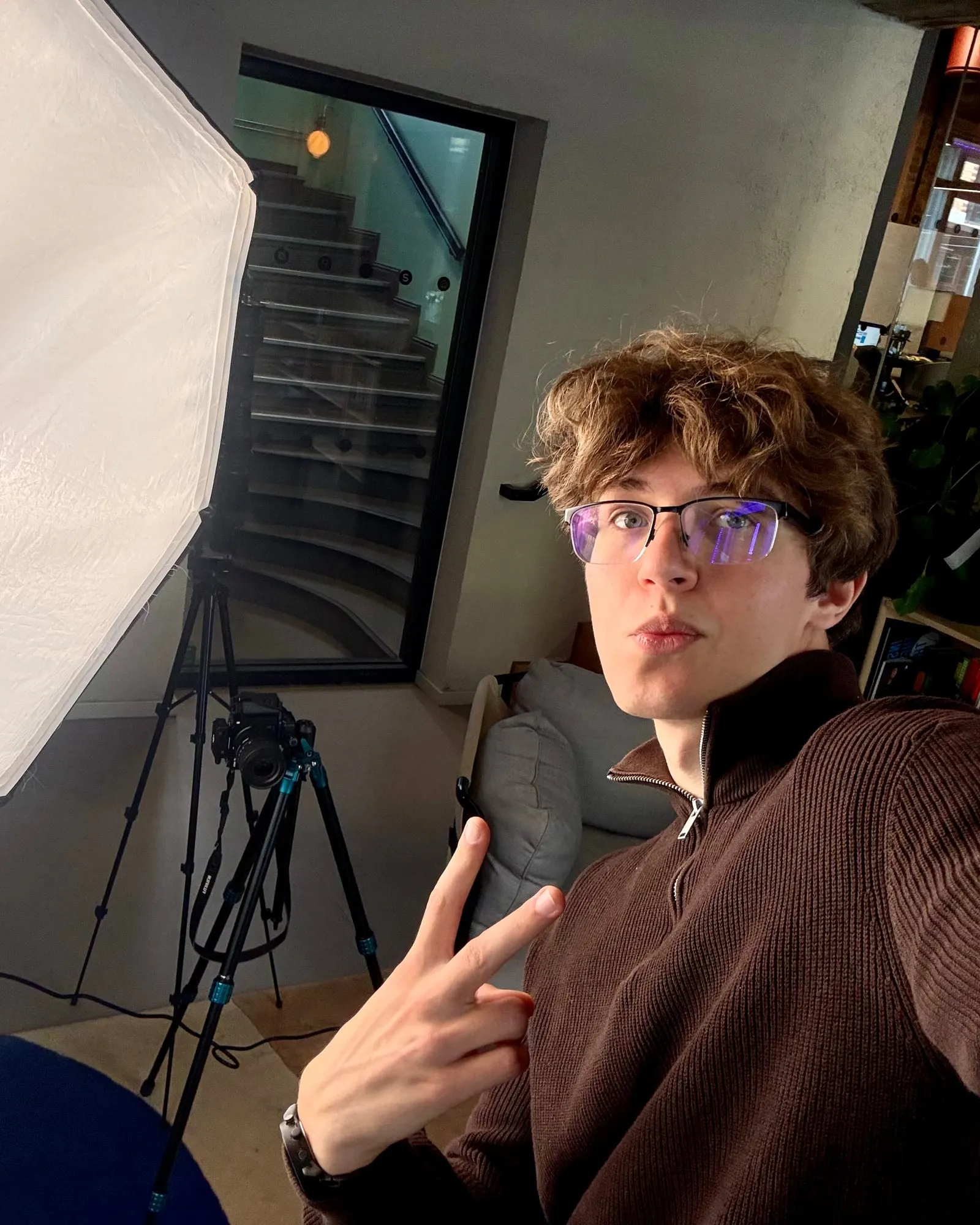 Vladyslav Yarovyi with his camera, lights and tripod